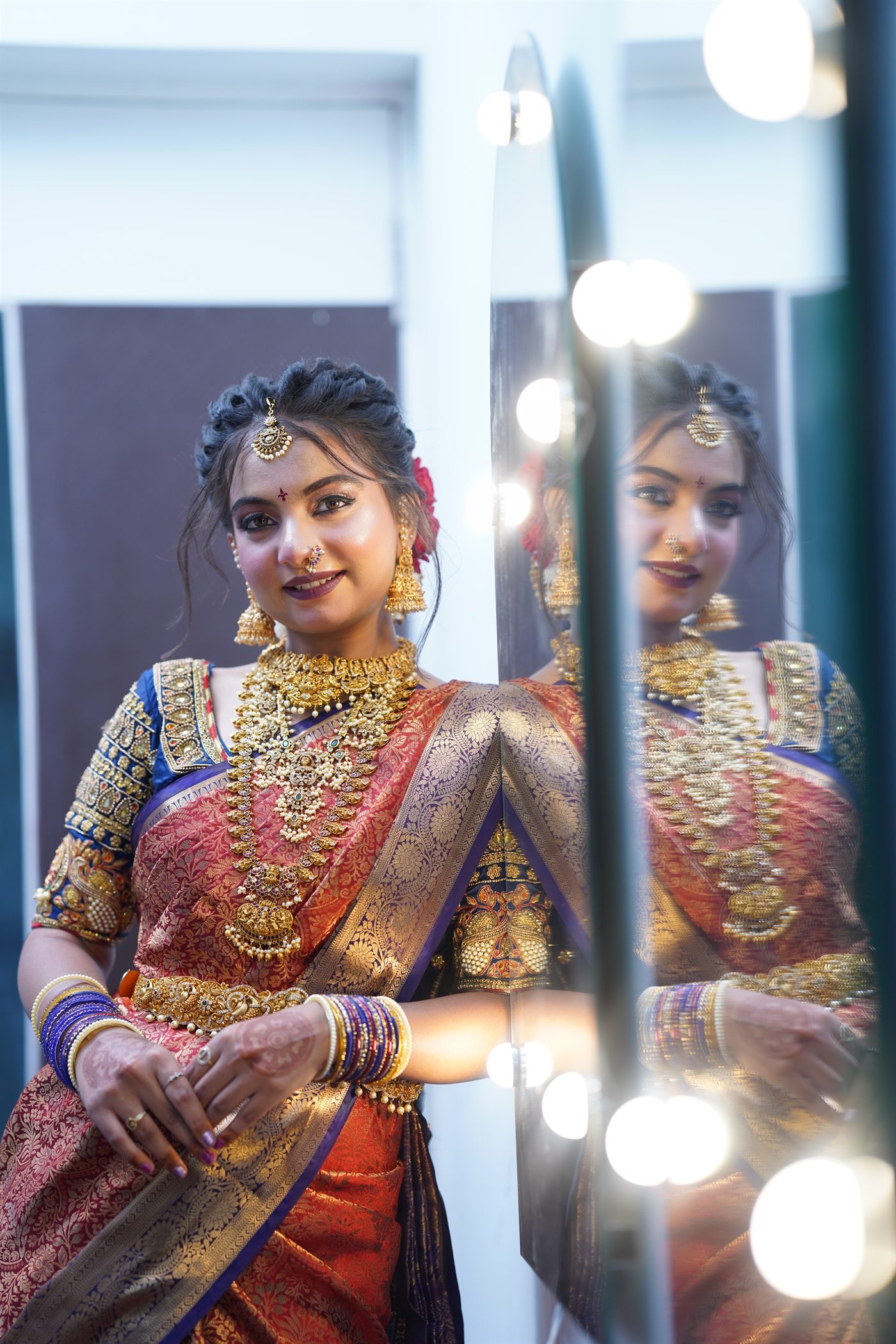 Bridal makeup look photographed beside a studio mirror